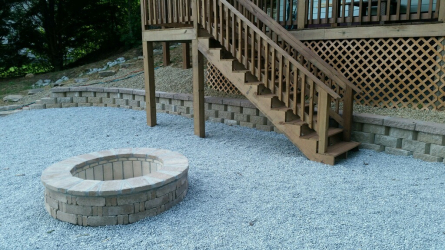 Brick paver fire pit and retaining wall by Gonzalez Landscaping and Home Improvement